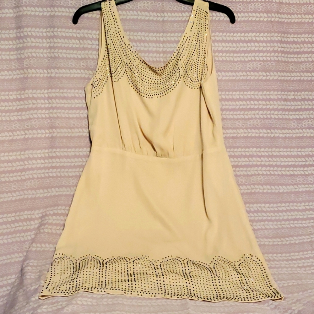 Beige dress, black and silver detail. Open tie back with zipper.